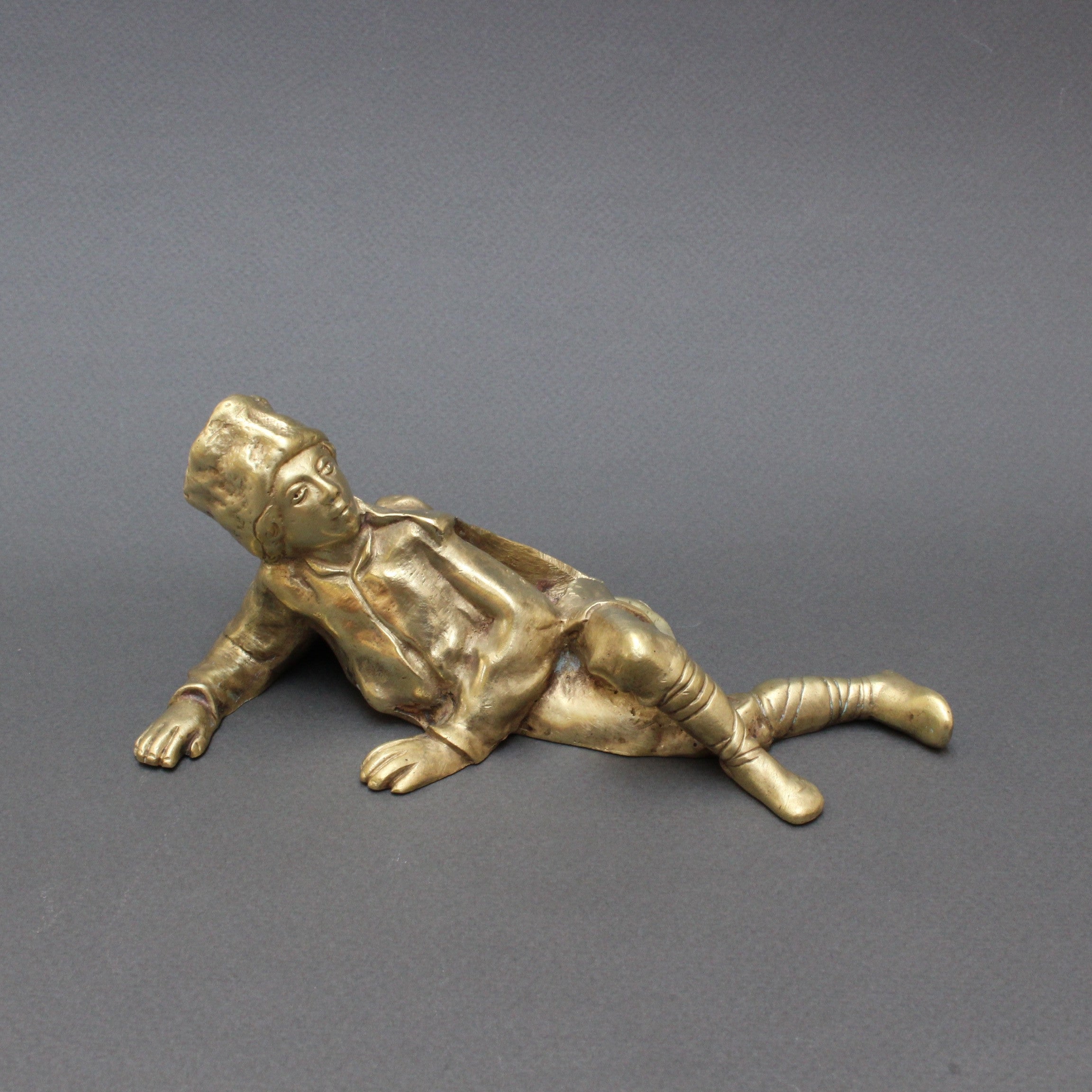 Italian Vintage Brass Desk Paperweight of Reclining Boy Soldier