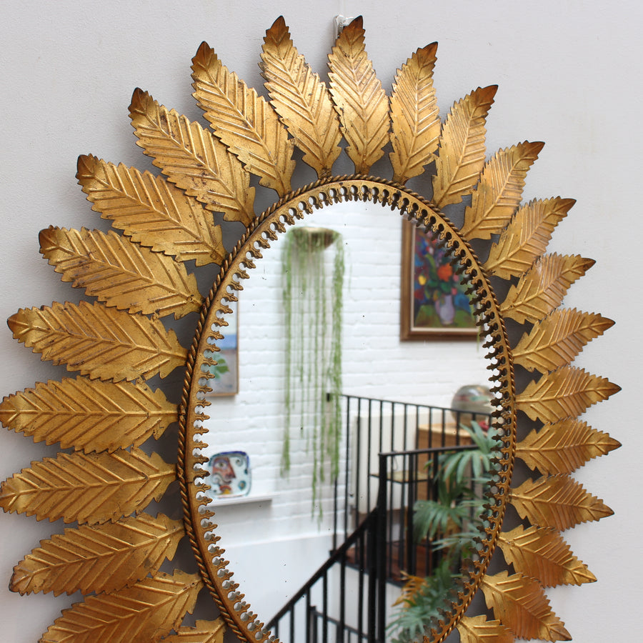 Vintage Spanish Gilt Metal Sunburst Mirror with Leaf Motif (circa 1970s)