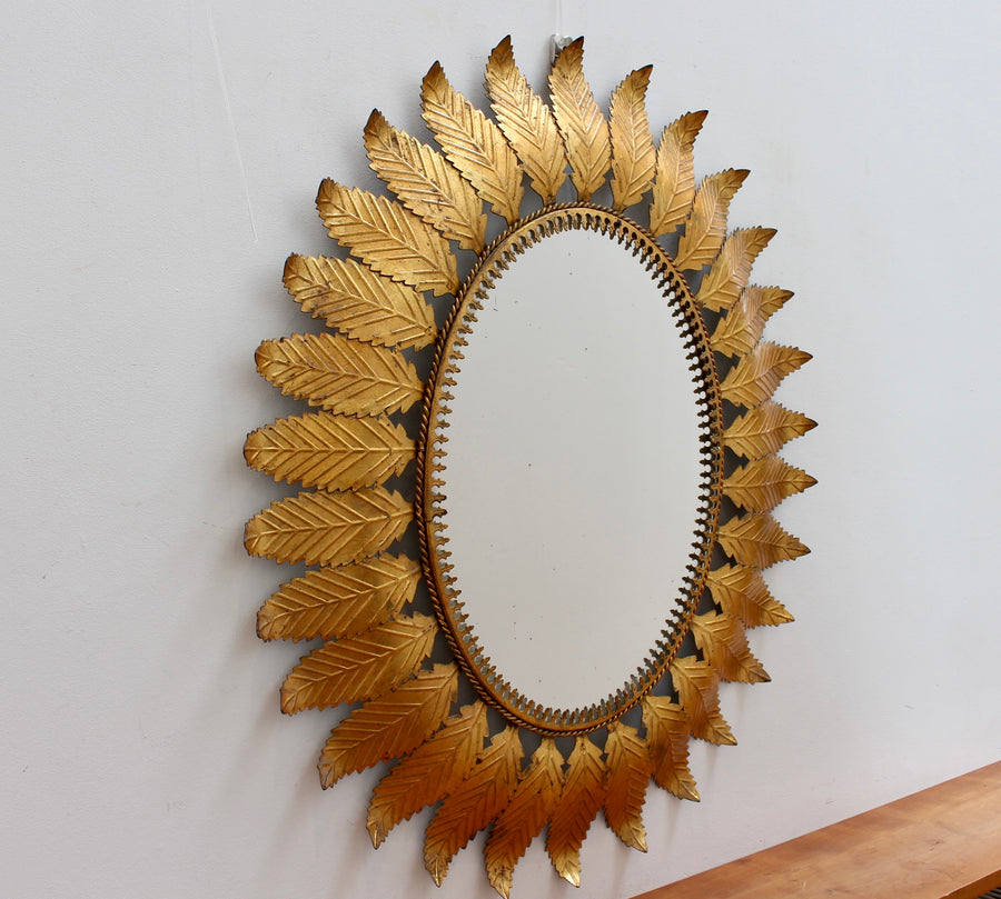 Vintage Spanish Gilt Metal Sunburst Mirror with Leaf Motif (circa 1970s)